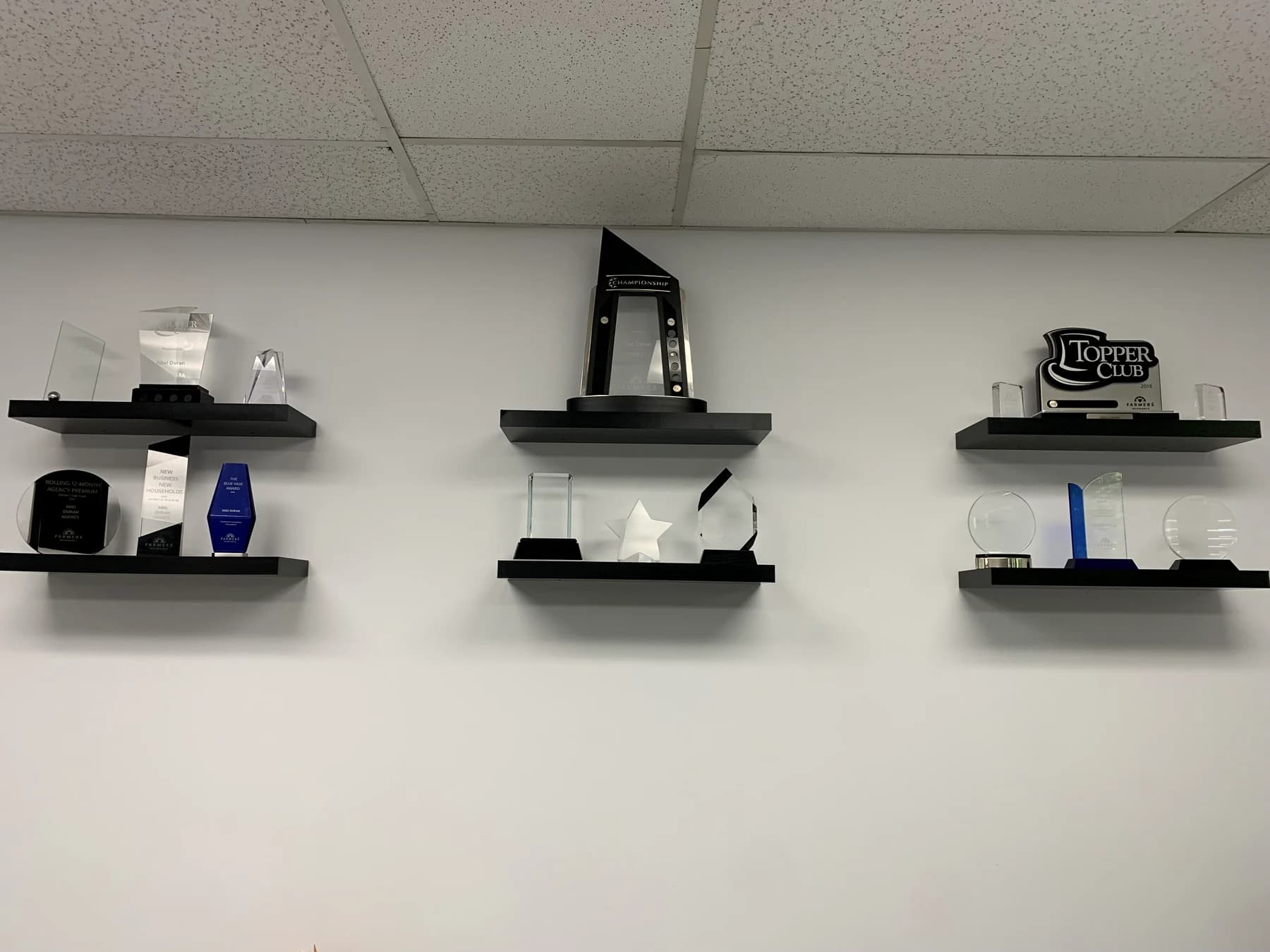 Detailed view of a glass recognition display inside the agency office