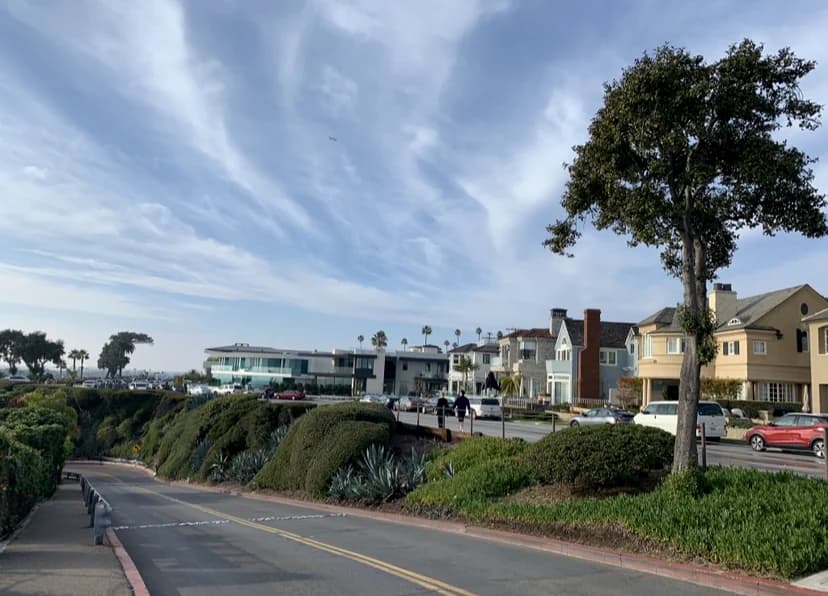 California coastal homes beside a landscaped public walkway