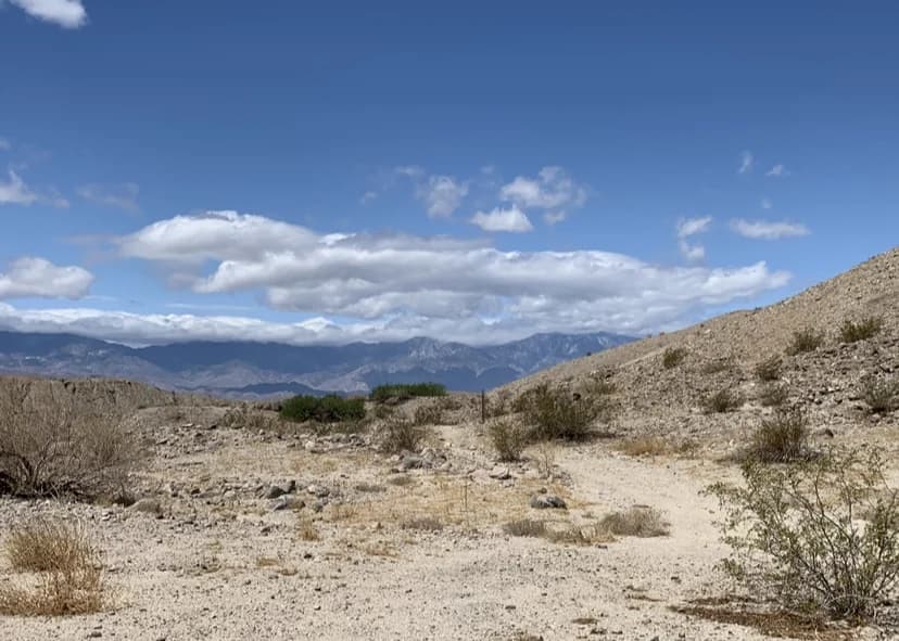 Rocky California terrain with mountains in the distance