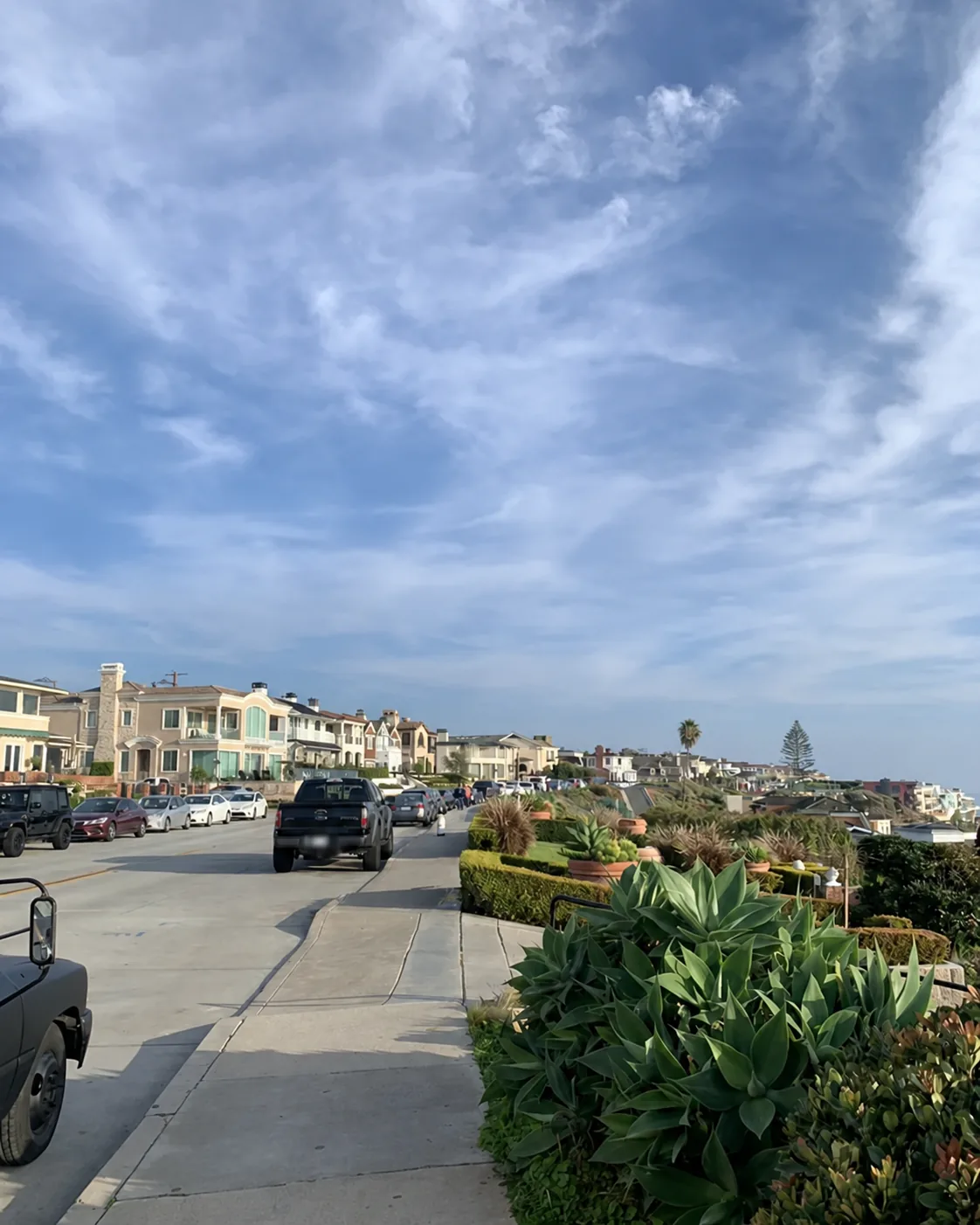 California residential neighborhood with attached homes and parked vehicles