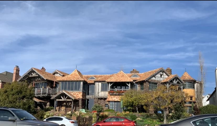 Large residential building with varied rooflines and exterior finishes